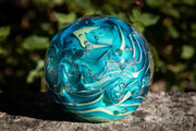 Glass orbs with cremation ash